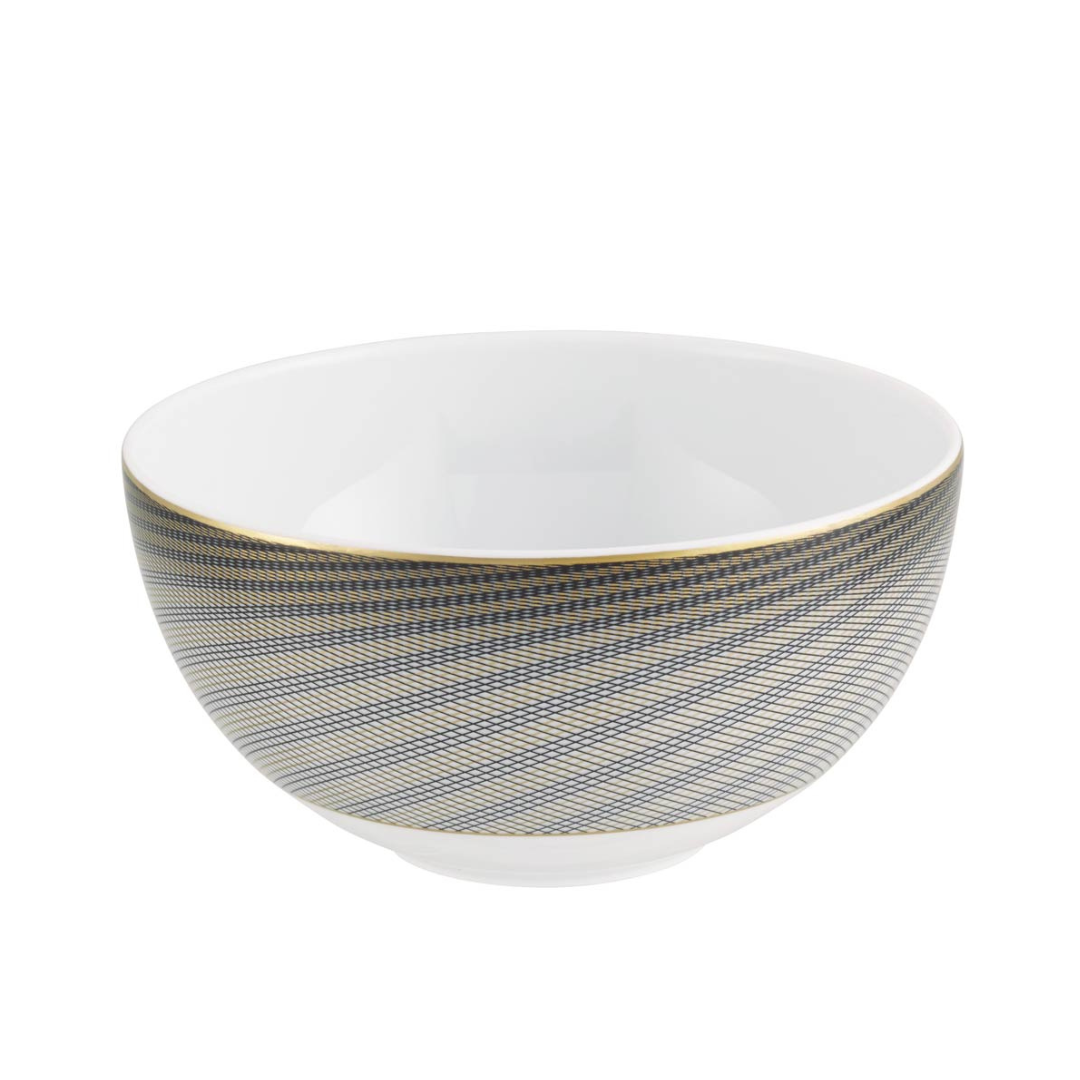 The Oskar Dinnerware bowl by Raynaud features white Limoges porcelain with blue and gold diagonal geometric stripes around the outside, a gold rim, and a plain white interior.