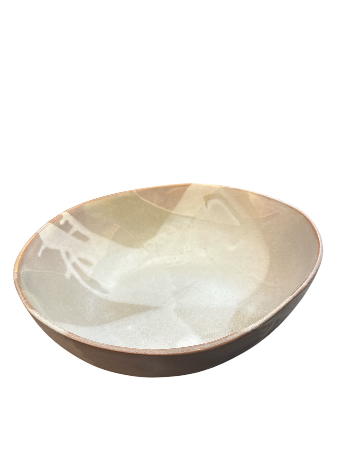 The Round Ceramic Bowls - Stone by Alex Marshall Studios features a shallow, round shape, light beige interior, and a slightly uneven rim that highlights the charm of handmade ceramics.