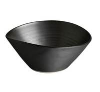 The Simon Pearce Barre Dinnerware Slate features a matte black, wide-rimmed stoneware bowl with a smooth finish and slightly off-white base, shown against a plain white background.