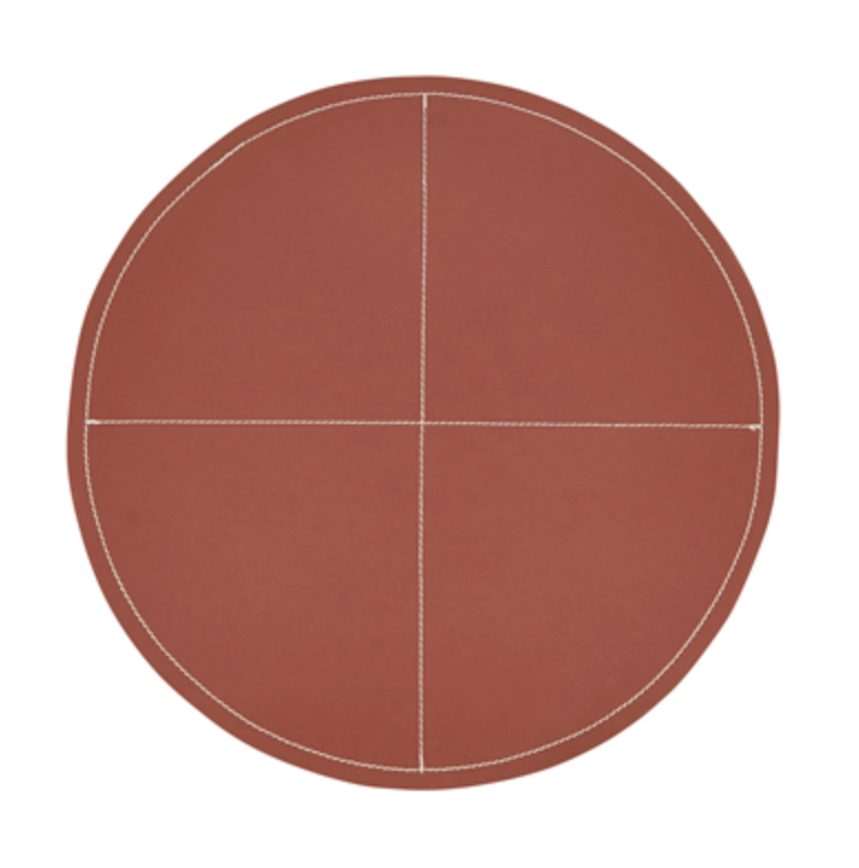 The Saro Trading Faux Leather Round Brown Placemat Set of 4 features white edge stitching and two intersecting white lines that divide each placemat into four neat quadrants.