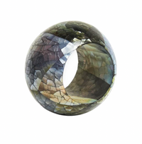 Add a touch of unique elegance to your table with the Shell Pearl Black Napkin Ring Set of 4 from Von Gern Home, featuring a round, wide design adorned with a mosaic of iridescent, cracked shell-like pieces in green, brown, and gray tones—perfect for those who appreciate stylish modern table decor.