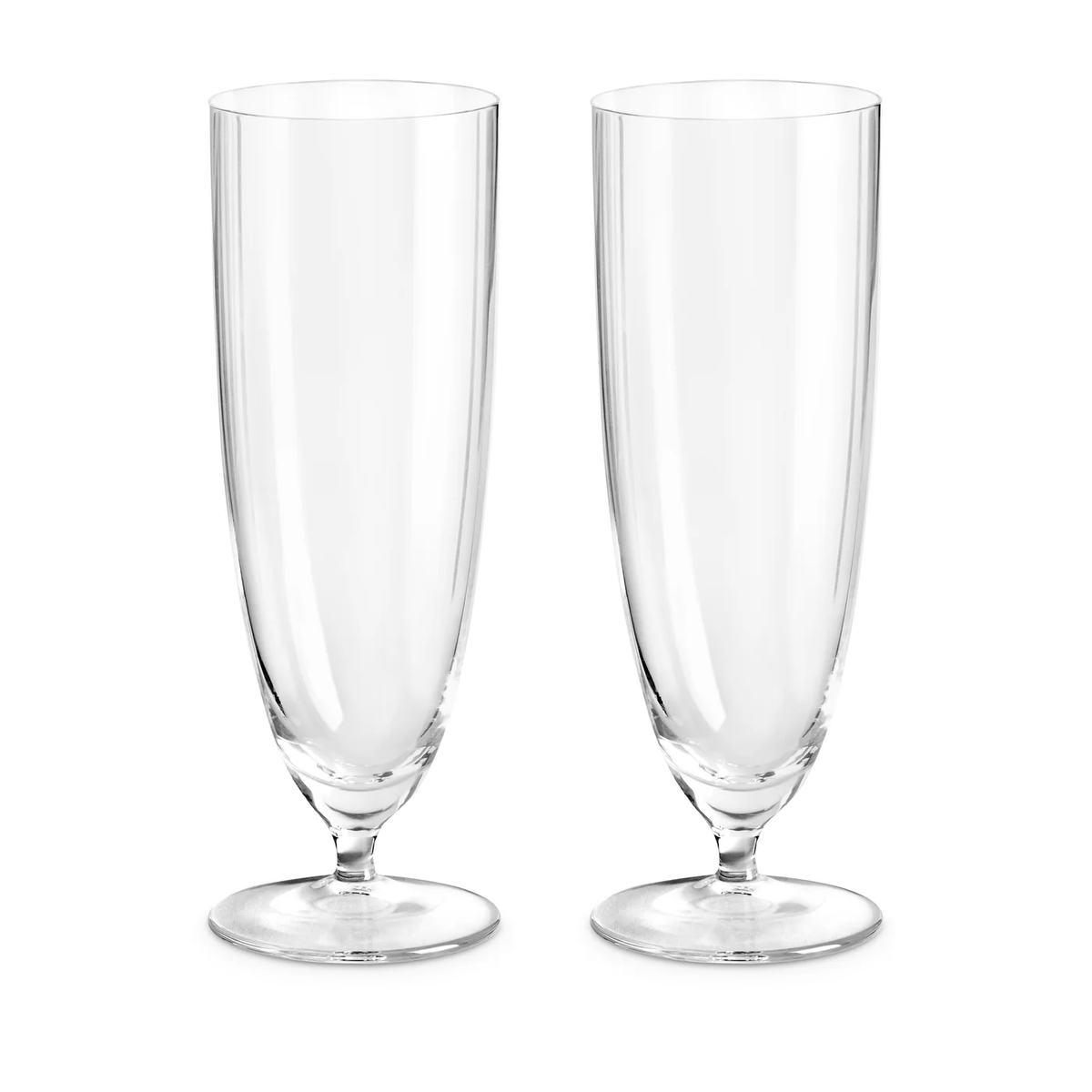 Two empty, clear champagne flutes from the Iris Drinkware Collection by L'Objet, crafted from mouth-blown glass, stand side by side on a white background.