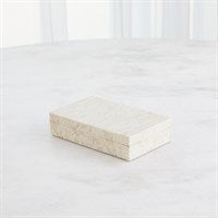 The Searchlight Box Ivory by Global Views/Surya is a small, rectangular ivory storage box with a lid, shown on a light marble surface against a softly blurred background—ideal for decorative storage.