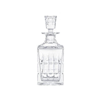 The Manhattan Square Decanter by Saint-Louis/Hermes is a clear, crystal decanter with a matching stopper and vertical geometric cuts, creating an elegant look against a plain white background.