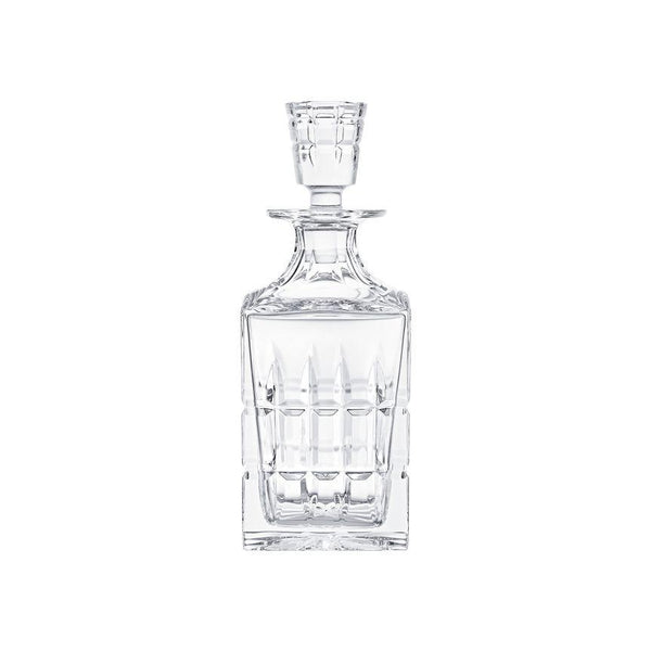 The Manhattan Square Decanter by Saint-Louis/Hermes is a clear, crystal decanter with a matching stopper and vertical geometric cuts, creating an elegant look against a plain white background.
