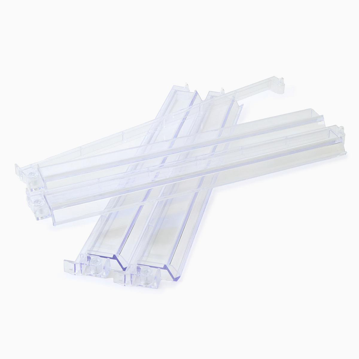 The Oh My Mahjong Mahjong Rack & Pusher Set - Clear features four transparent, rectangular pushers with angled ends, arranged in an overlapping design on a white background—perfect accessories for American Mahjong racks.