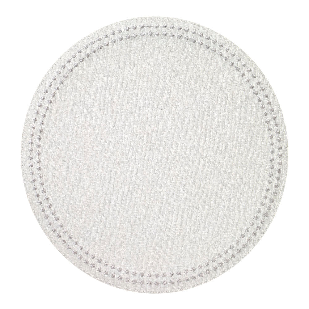 A set of four round, white placemats from Bodrum’s Pearls collection, each featuring a textured bead pattern forming two concentric circles near the edge. The smooth, unadorned center offers an elegant foundation for your tableware and pairs beautifully with refined dinner plates for a sophisticated table setting.