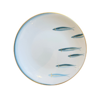 A round white porcelain plate with a blue painted border and six blue fish illustrations, finished with a thin gold rim, shown on a plain white background.
