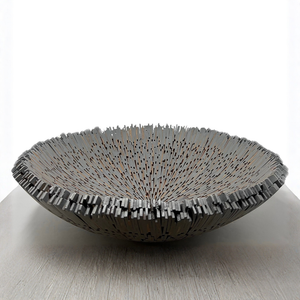 Boracay Centerpiece Bowl, a handcrafted shallow bowl composed of many thin, upright rectangular segments arranged in a radial pattern.