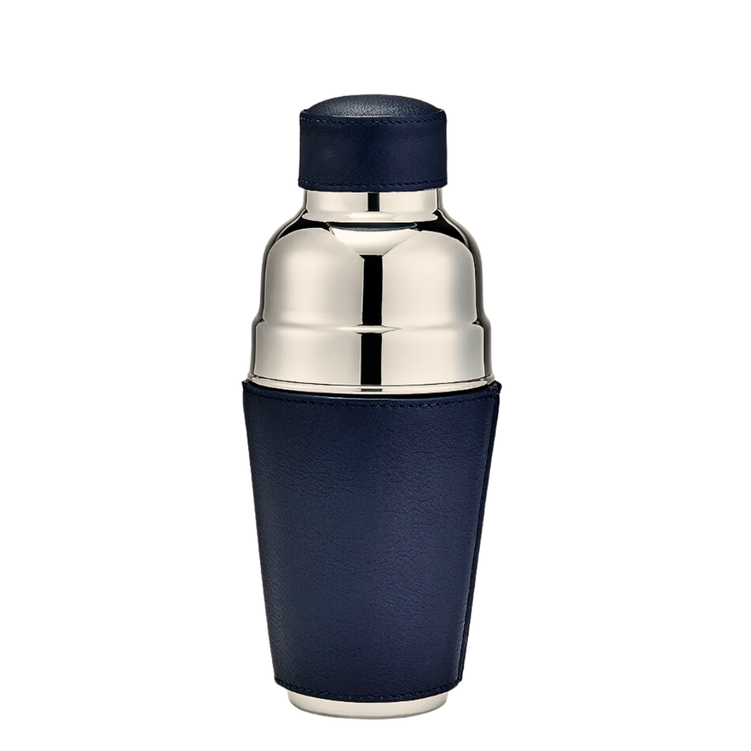 The Graphic Image Leather Black Cocktail Shaker features stainless steel construction and a dark blue leather sleeve covering the lower half, standing upright on a white background—an elegant barware addition to any home.
