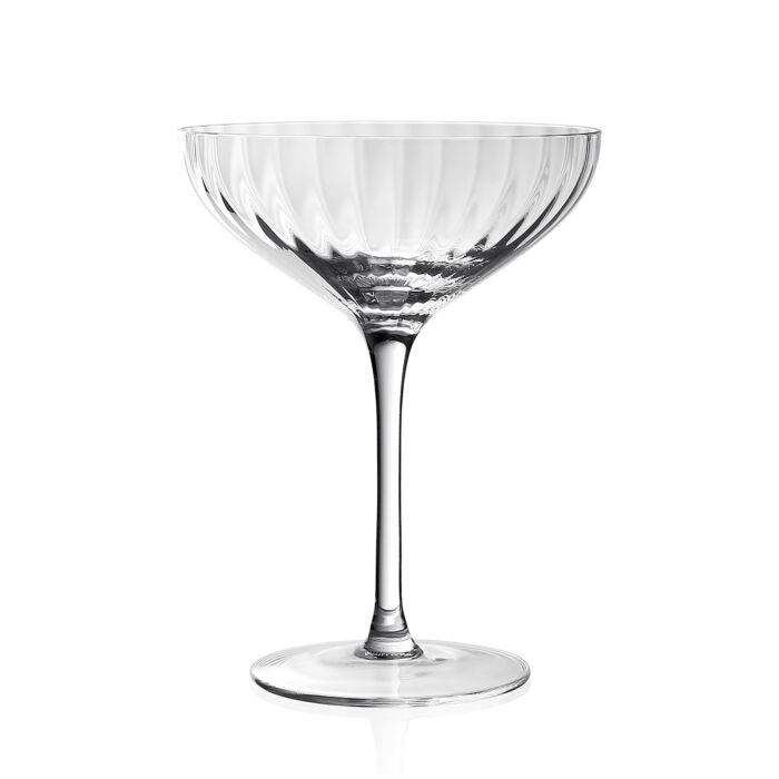 The William Yeoward Corinne Coupe Champagne 6oz features a clear, textured fluted bowl with a long slender stem and round base, exemplifying elegant glassware against a plain white background.