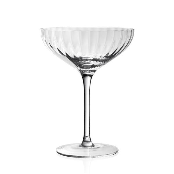 The William Yeoward Corinne Coupe Champagne 6oz features a clear, textured fluted bowl with a long slender stem and round base, exemplifying elegant glassware against a plain white background.