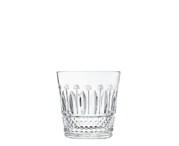 The Saint-Louis Tommy Barware tumbler features diamond-cut facets at the base and elongated oval patterns near the top, highlighting fine glasscraft artistry against a plain white background.