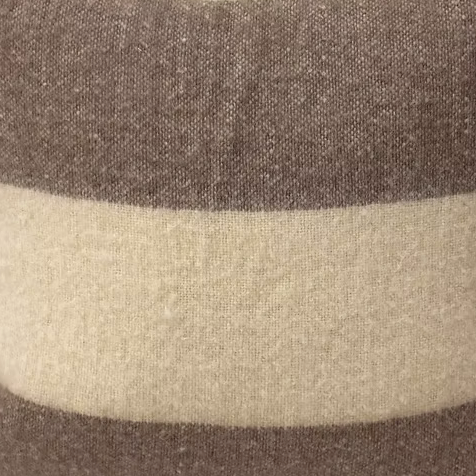 Close-up of the Decorum Bowie Throw Stripe, showcasing its soft, textured fabric with wide beige and light brown stripes—a versatile neutral throw to enhance any space.