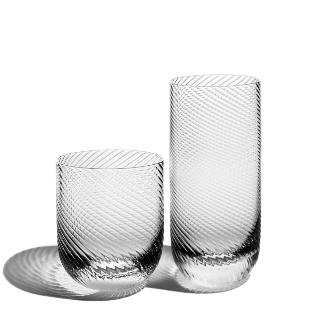 The Richard Brendon Optic Glassware Clear Set of 2 features two ribbed glass tumblers with a diagonal texture, elegantly displayed on a white background.