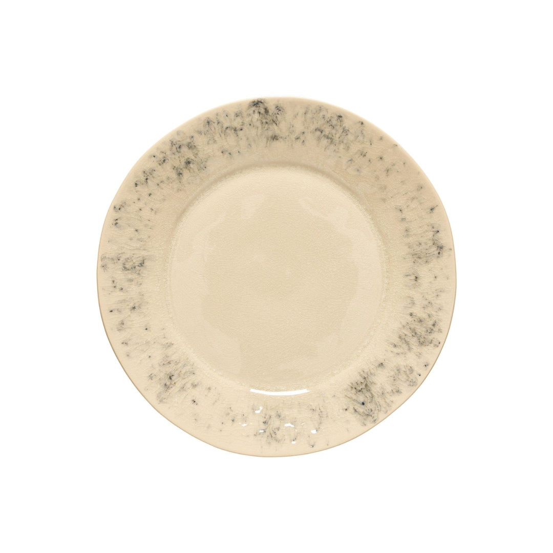 The Costa Nova Madeira Dinnerware Cream is a round, beige stoneware plate with a subtle speckled gray rim, expertly handcrafted in Portugal, shown on a white background.