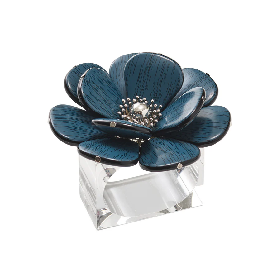 Add a touch of artistry to your décor with this decorative blue flower sculpture featuring a silver center, crafted from metal and set on a clear rectangular acrylic base—reminiscent of the elegant Begonia Napkin Rings Set of 4 in Teal by Kim Seybert.