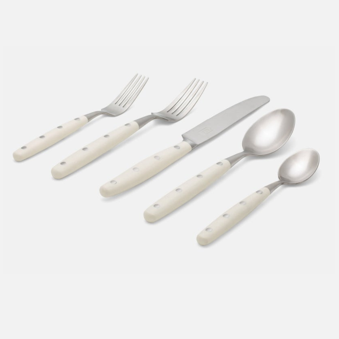 The Jones Flatware Ivory by Blue Pheasant is a five-piece stainless steel set—two forks, knife, tablespoon, and teaspoon—with ivory handles and three rivets. Stylish, dishwasher safe flatware for modern dining.