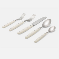 The Jones Flatware Ivory by Blue Pheasant is a five-piece stainless steel set—two forks, knife, tablespoon, and teaspoon—with ivory handles and three rivets. Stylish, dishwasher safe flatware for modern dining.