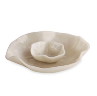 The Beatriz Ball Resin Alabaster Chip & Dip set features two off-white bowls with organic, wavy edges and a glossy finish—perfect for serving chips and dip with the elegance of alabaster resin serveware.