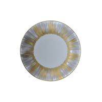 The Marie Daage Panache plate by Marie Daâge is a round Limoges porcelain piece featuring metallic silver and gold radial brushstrokes on the rim, set on a plain white background—a luxurious addition to any table.