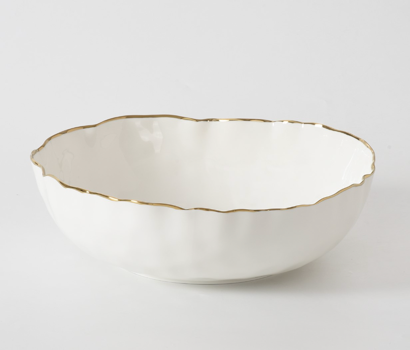 The PAMPA BAY Portofino Serving Bowl features white porcelain with a scalloped, irregular edge and delicate gold trim, shown on a plain white background.