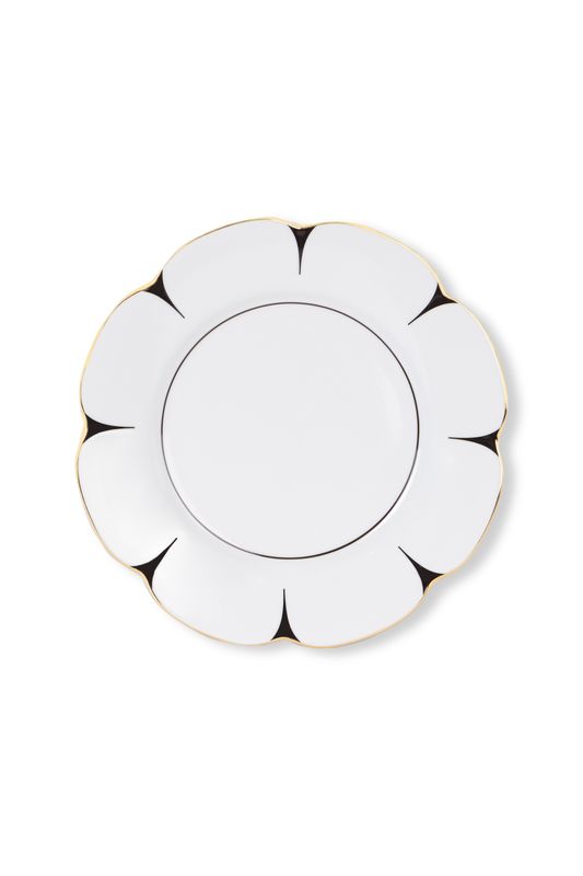The Drops Dinnerware plate by Molecot features white Limoges porcelain in a flower shape with scalloped edges, black petal-like accents, and a slim gold-finished rim, shown against a white background.