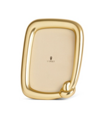 A L’Objet Jessica McCormack Knot Frame Gold featuring a rounded, knotted corner.
