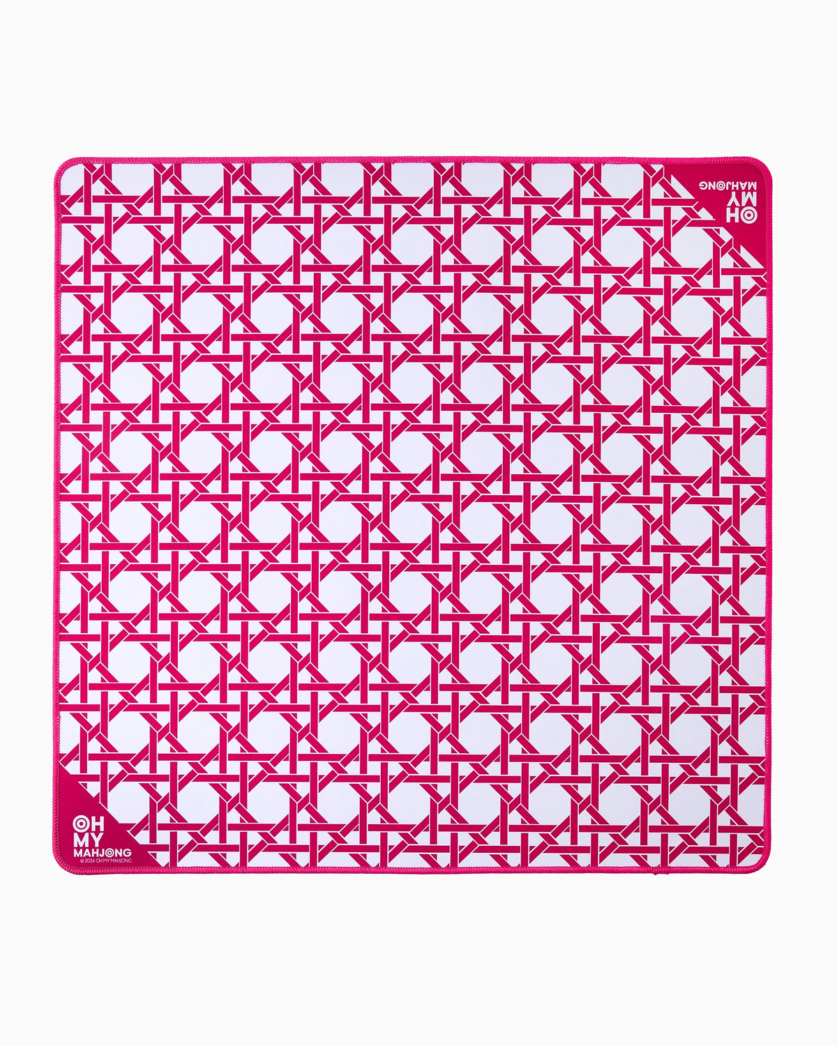 The Oh My Mahjong Travel Mini Mahjong Game Mat is a 22” x 22” square mat with rounded corners, showcasing a pink and white geometric pattern of interlocking circles and lines, plus Oh My Mahjong branding in the corners.
