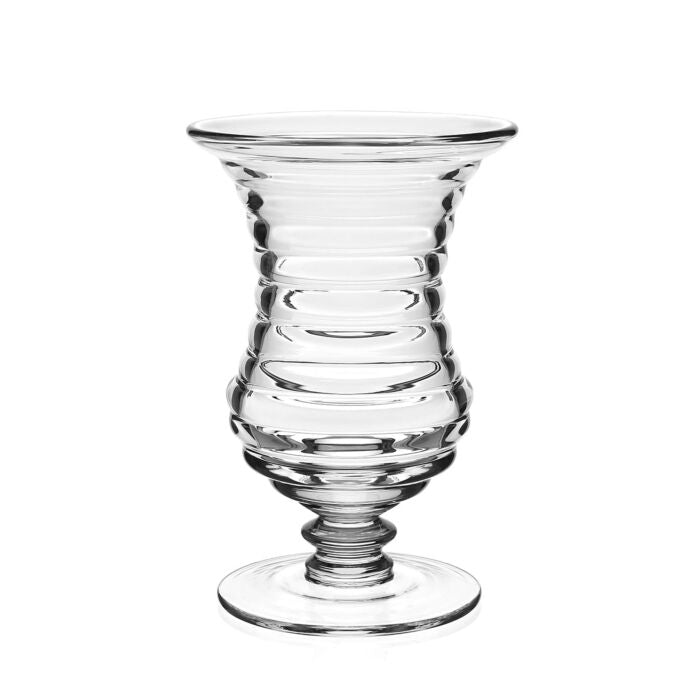 The Ripples Footed Vase by William Yeoward features clear glass with a ripple effect, flared rim, ribbed body, and round base—perfect for elegant flower arrangements. Displayed on a plain white background.