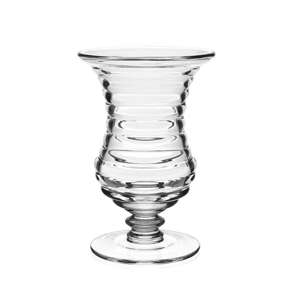 The Ripples Footed Vase by William Yeoward features clear glass with a ripple effect, flared rim, ribbed body, and round base—perfect for elegant flower arrangements. Displayed on a plain white background.