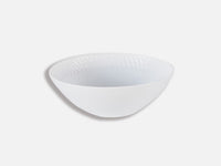 The Twist White Dinnerware bowl by Bernardaud is made from Limoges porcelain, featuring a subtle textured rim, shown here against a light gray background.