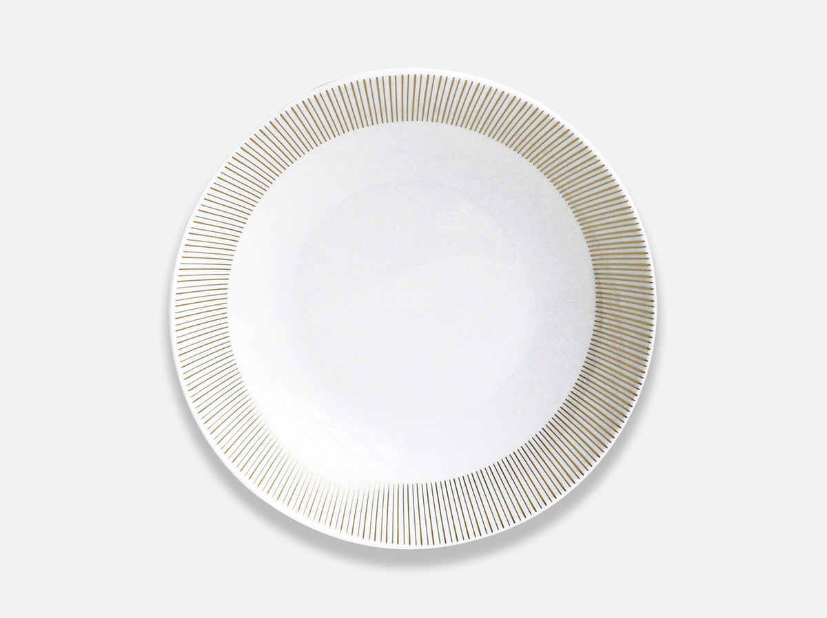 The Sol Dinnerware plate by Bernardaud is made of white Limoges porcelain with evenly spaced thin gold lines around the rim, displayed on a light gray background.
