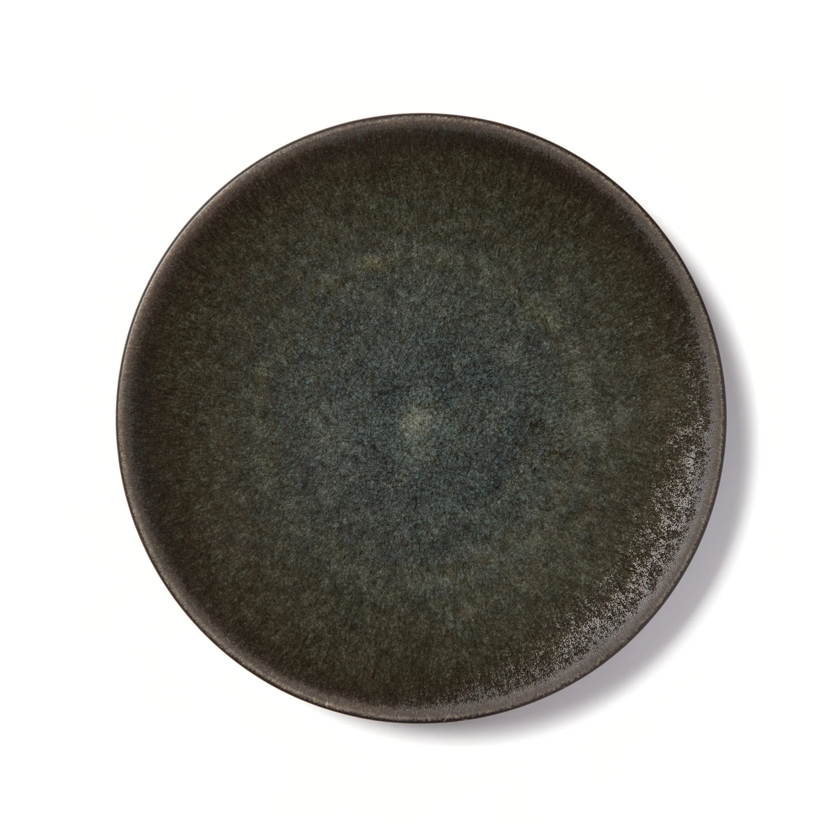 The Tourron Samoa round stoneware plate by Jars - Rosenthal features a dark, artisan design with a textured gradient in deep green and gray, shown from above on a white background.