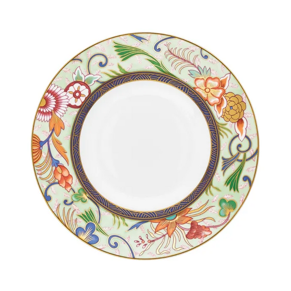 The Raynaud Imari Dinnerware plate features a wide border hand-painted in Japanese floral motifs with red, orange, blue, green, and gold on a pale ground; the center remains plain white.