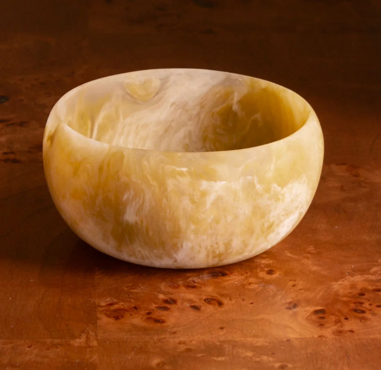 The Beatriz Ball Resin Sorbet Mini Bowl in Matcha features a unique marbled pattern in green tones, making it a standout piece of tableware for any setting.
