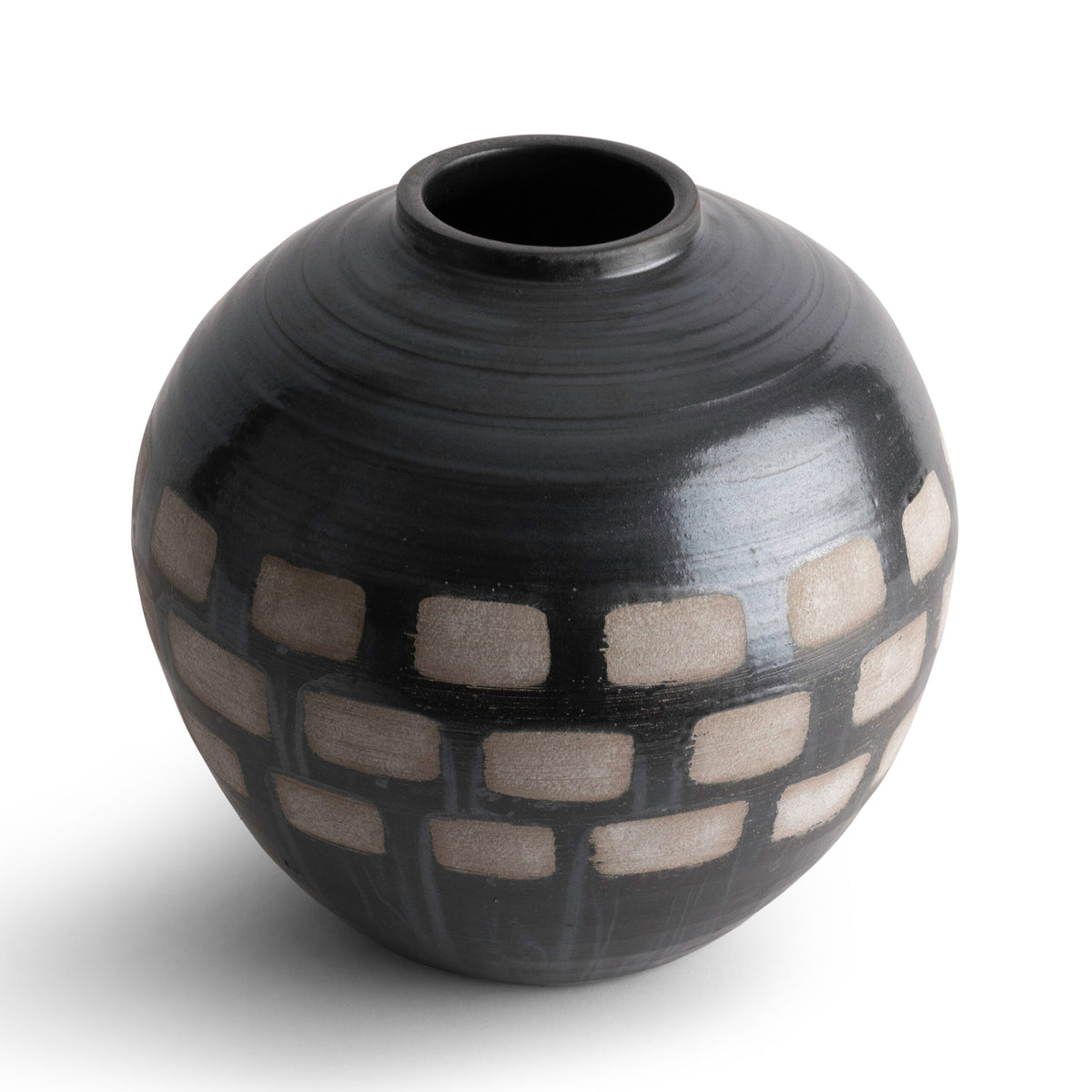 The Jude Vase by FlowDecor Inc. is a round, black ceramic piece featuring a handmade pattern of beige rectangular blocks in horizontal rows—ideal for organic modern decor.