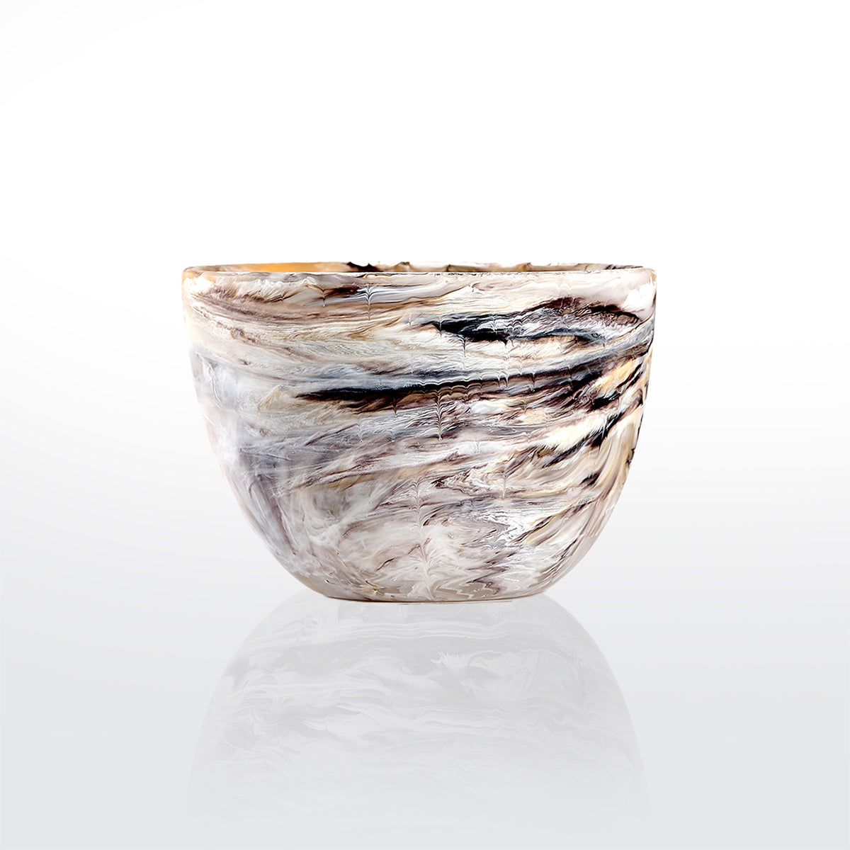 The Nashi Home Swirl Colored Resin Deep Bowl features a marbled pattern in white, beige, brown, and black, shown on a plain white background with a subtle reflection underneath.