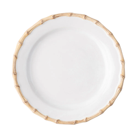 The Juliska Bamboo Dinnerware is a white ceramic plate with a raised rim styled like light brown bamboo stalks, shown from above on a white background.