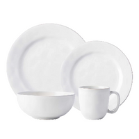Juliska Puro Dinnerware White set features a dinner plate, salad plate, bowl, and mug, all displayed together on a white background.