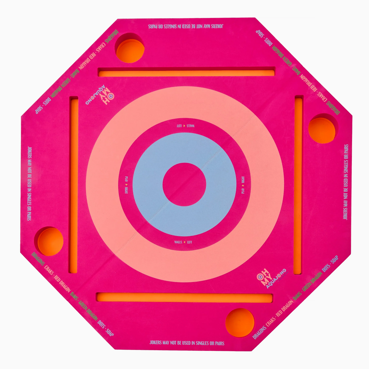The Mahjong Aqua Pool Mat by Oh My Mahjong is a pink octagonal game board with a circular blue-purple target, four corner holes, straight grooves, and white instructions on the edges, inspired by a pool Mahjong mat.