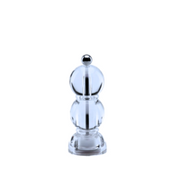 The Addison Ross Mini Bobbin Salt & Pepper Shaker features a clear, round glass body, a metallic top knob, and a long-lasting ceramic grinder mill, shown against a plain white background.