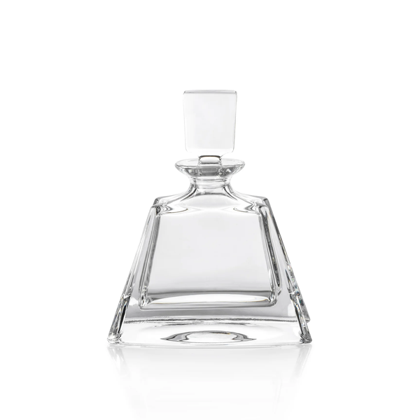 The Zodax Noelle Crystal Decanter features a clear, empty crystal design with a wide base, angled sides, and a square glass stopper. Displayed against a white background, this elegant piece of barware is perfect for elevating your home bar.