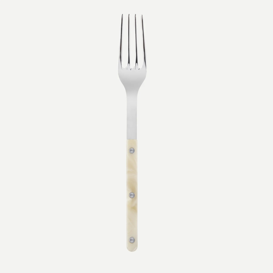 The Sabre Bistro Horn Serving Fork, made in France, features a stainless steel four-tine head and a light-colored handle with three rivets. It is displayed on a white background.