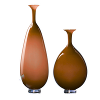 Two glossy, aubergine Trumpet Vases by Tyler Barry Design, one taller and more elongated than the other, are displayed side by side on clear circular bases against a white background.