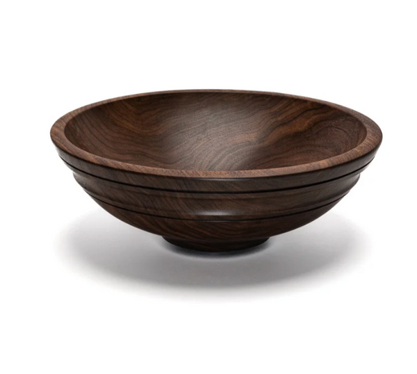 The Willoughby (Round with Ridge) Walnut Wooden Bowl Collection 12″ by Andrew Pearce is a round, dark wooden bowl featuring a smooth, polished finish and subtle carved ridges, shown against a white background.