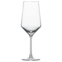 A clear, empty Zweisel Pure Barware wine glass by Zwiesel Fortessa, featuring a long stem and wide bowl crafted from Tritan material, is photographed against a plain white background.