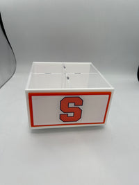 The Eye Candy College Spinner is a white rectangular desk organizer with four compartments, featuring a bold orange letter S outlined in black on the front.