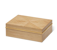 The Marcello Box Oak by Aerin is a rectangular Art Deco wood box featuring a geometric lid pattern and a slim gold accent line along the edge, displayed on a plain white background.