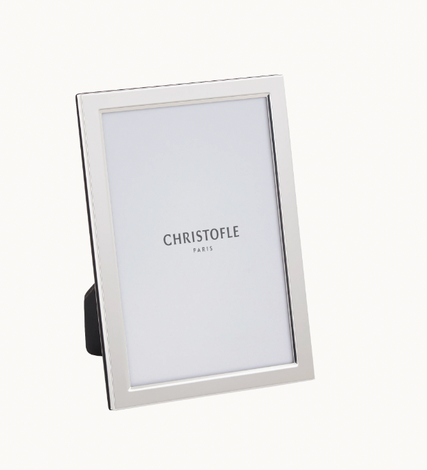 The Christofle Uni Picture Frame features a simple, modern silver design and stands upright on a white background. Ideal as an engravable photo frame, it displays the text CHRISTOFLE PARIS in its placeholder.